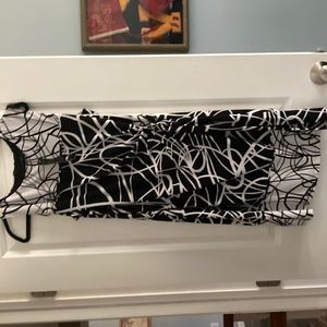 Black and white knee length dress. Attached side tie